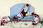 SAN JOSE, CA - MAY 01:  Jimmy Howard #35 of the Detroit Red Wings makes a diving save during the second period of their game against the San Jose Sharks in Game Two of the Western Conference Semifinals during the 2011 NHL Stanley Cup Playoffs at HP Pavilion on May 1, 2011 in San Jose, California. Howard's teammates Jonathan Ericsson #52 and Ruslan Salei #24 watch their goalie make the save.  (Photo by Ezra Shaw/Getty Images)