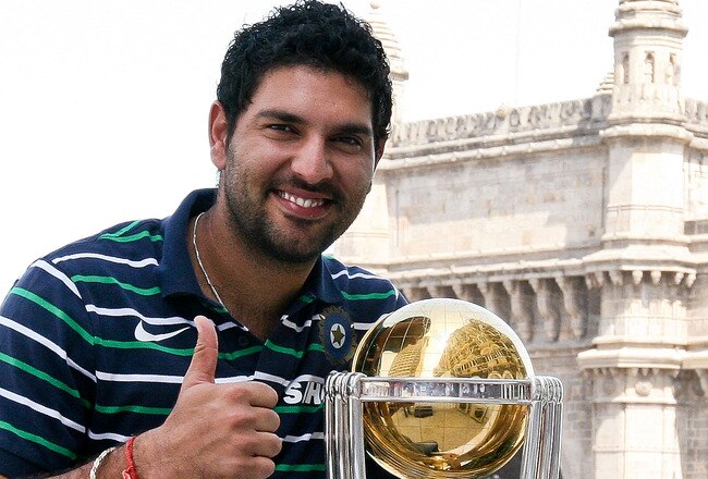 MUMBAI, INDIA - APRIL 03:  Yuvraj Singh of the Indian cricket team poses with the  ICC Cricket World Cup Trophy, with the Gateway of India in the backdrop, during a photo call at the Taj Palace Hotel on April 3, 2011 in Mumbai, India.  (Photo by Ritam Banerjee/Getty Images)
