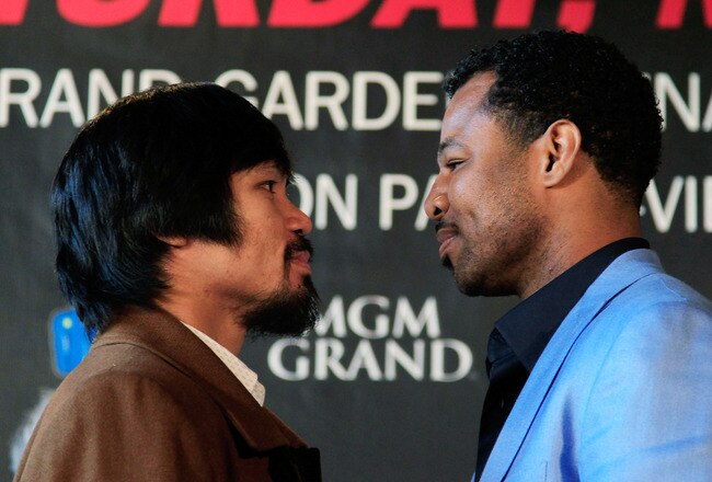 NEW YORK, NY - FEBRUARY 14:  (L) Manny Pacquiao and (R) Shane Mosley square up at a press conference to promote their upcoming fight at The Lighthouse at Chelsea Piers on February 14, 2011 in New York City.  (Photo by Chris Trotman/Getty Images)