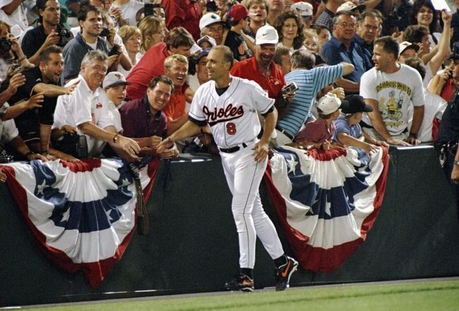 6 Sep 1995:  Shortstop Cal Ripken of the Baltimore Orioles runs past fans at Camden Yards in Baltimore, Maryland acknowledging congratulations for breaking Lou Gehrig''s record for consecutive games played.  The game was against the California Angels and the Orioles won 4-2. Mandatory Credit: Doug Pensinger  /Allsport