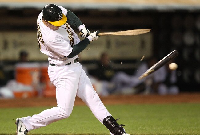 OAKLAND, CA - APRIL 01:  Josh Willingham #16 of the Oakland Athletics breaks his bat and hits into a fielder's choice against the Seattle Mariners during an opening day game of Major League Baseball at the Oakland-Alameda County Coliseum on April 1, 2011 in Oakland, California.  (Photo by Jed Jacobsohn/Getty Images)