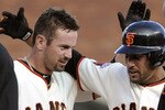 SAN FRANCISCO, CA - APRIL 8: Aaron Rowand #33 (L) of the San Francisco Giants celebrates with Andres Torres #56 after Rowand gets a walk off hit to drive in Torres for the winning run in the Bottom of the 12 inning agains the St. Louis Cardinals to win the game 5-4 at AT&T Park, April 8, 2011 in San Francisco, California. (Photo by Thearon W. Henderson/Getty Images)