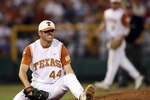 OMAHA, NE - JUNE 24:  Austin Wood #44 of the Texas Longhorns winces after getting hit by a ball against the Louisiana State University Tigers during Game 3 of the 2009 NCAA College World Series at Rosenblatt Stadium on June 24, 2009 in Omaha, Nebraska. The Tigers defeated the Longhorns 11-4 to win the national title.  (Photo by Elsa/Getty Images)