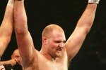 HOLLYWOOD, FL - SEPTEMBER 20:  Ben Rothwell (yellow trunks) celebrates his victory over Ricco Rodriguez during their heavyweight bout during the IFL finals at the Seminole Hard Rock Casino on September 20, 2007 in Hollywood, Florida.  (Photo by Doug Benc/Getty Images for IFL)