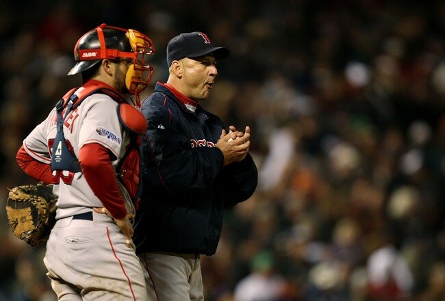 DENVER - OCTOBER 27:  (L-R) Catcher Jason Varitez and manager Terry Francona #47 of the Boston Red Sox wait for Jonathan Papelbon #58 runs to the mound from the bullpen in the bottom of the eighth inning against the Colorado Rockies during Game Three of the 2007 Major League Baseball World Series at Coors Field on October 27, 2007 in Denver, Colorado.  (Photo by Jonathan Daniel/Getty Images)