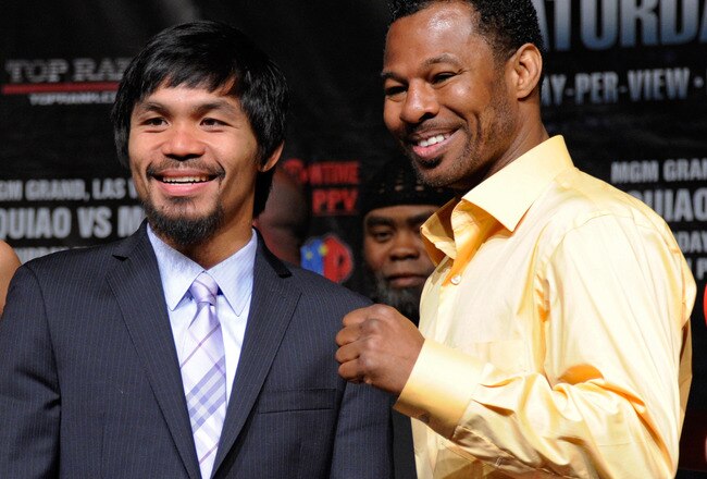 LAS VEGAS, NV - MAY 04:  Boxers Manny Pacquiao (L) and Shane Mosley pose during the final news conference for their bout at the MGM Grand Hotel/Casino May 4, 2011 in Las Vegas, Nevada. Pacquiao will defend his WBO welterweight title against Mosley on May 7, 2011 in Las Vegas.  (Photo by Ethan Miller/Getty Images)