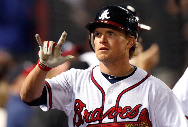 ATLANTA, GA - MAY 04:  Nate McLouth #13 of the Atlanta Braves reacts after hitting a two-run homer in the fourth inning against the Milwaukee Brewers at Turner Field on May 4, 2011 in Atlanta, Georgia.  (Photo by Kevin C. Cox/Getty Images)