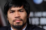 LAS VEGAS, NV - MAY 04:  Boxer Manny Pacquiao appears during the final news conference for his bout against Shane Mosley at the MGM Grand Hotel/Casino May 4, 2011 in Las Vegas, Nevada. Pacquiao will defend his WBO welterweight title against Mosley on May 7, 2011 in Las Vegas.  (Photo by Ethan Miller/Getty Images)
