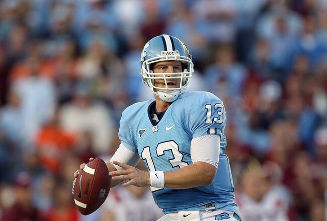 CHAPEL HILL, NC - NOVEMBER 13:  T.J. Yates #13 of the North Carolina Tar Heels drops back to throw a pass against the Virginia Tech Hokies during their game at Kenan Stadium on November 13, 2010 in Chapel Hill, North Carolina.  (Photo by Streeter Lecka/Getty Images)