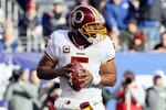 EAST RUTHERFORD, NJ - DECEMBER 05:  Donovan McNabb #5 of the Washington Redskins looks to throw a pass against the New York Giants on December 5, 2010 at the New Meadowlands Stadium in East Rutherford, New Jersey. The Giants defeated the Redskins 31-7.  (Photo by Jim McIsaac/Getty Images)
