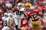 SAN FRANCISCO - OCTOBER 17:  Nnamdi Asomugha  #21 of the Oakland Raiders breaks up a pass intended for Michael Crabtree #15 of the San Francisco 49ers at Candlestick Park on October 17, 2010 in San Francisco, California.  (Photo by Ezra Shaw/Getty Images)