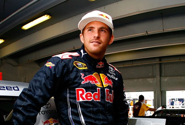 HOMESTEAD, FL - NOVEMBER 20:  Scott Speed, driver of the #82 Red Bull Toyota, stands in the garage during practice for the NASCAR Sprint Cup Series Ford 400 at Homestead-Miami Speedway on November 20, 2010 in Homestead, Florida.  (Photo by Jason Smith/Getty Images for NASCAR)