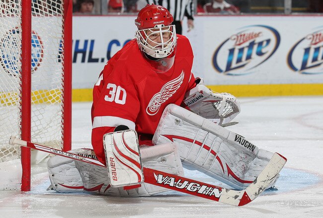 DETROIT, MI - JANUARY 2:  Chris Osgood #30 of the Detroit Red Wings turns a shot away in a game against the Philadelphia Flyers on January 2, 2011 at the Joe Louis Arena in Detroit, Michigan. The Flyers defeated the Wings 3-2. (Photo by Claus Anderzen/Getty Images)