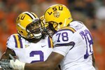AUBURN, AL - SEPTEMBER 20:  Offensive lineman Joseph Barksdale #78 and wide receiver Demetrius Byrd #2 of the LSU Tigers celebrate a touchdown catch by Byrd against the Auburn Tigers at Jordan-Hare Stadium on September 20, 2008 in Auburn, Alabama. LSU defeated Auburn 26-21.  (Photo by Doug Benc/Getty Images)
