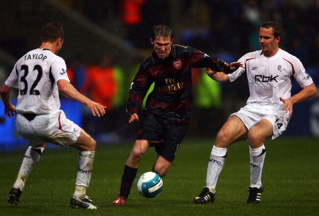 BOLTON, UNITED KINGDOM - MARCH 29:  Matt Taylor and Kevin Davies of Bolton attempt to stop Alex Hleb of Arsenal during the Barclays Premiership match between Bolton Wanderers and Arsenal at the Reebok Stadium on March 29, 2008 in Bolton, England.  (Photo by Alex Livesey/Getty Images)