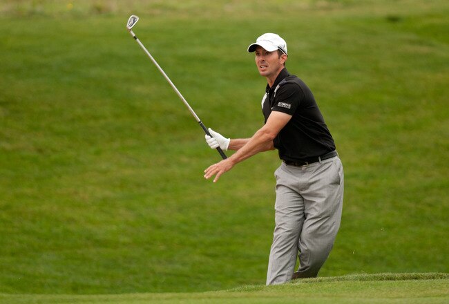 SAN ANTONIO, TX - APRIL 14: Mike Weir of Canada follows through on an approach shot during the first round of the Valero Texas Open at the AT&T Oaks Course at TPC San Antonio on April 14, 2011 in San Antonio, Texas. (Photo by Darren Carroll/Getty Images)