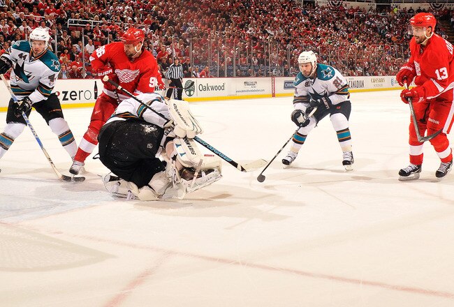 DETROIT - MAY 4:  Pavel Datsyuk #13 of the Detroit Red Wings scores a power play goal in the second period on goaltender Antti Niemi #31 of the San Jose Sharks in Game Three of the Western Conference Semifinals during the 2011 NHL Stanley Cup Playoffs on May 4, 2011 at Joe Louis Arena in Detroit, Michigan. San Jose defeated Detroit 4-3 in overtime.   (Photo by Jamie Sabau/Getty Images)