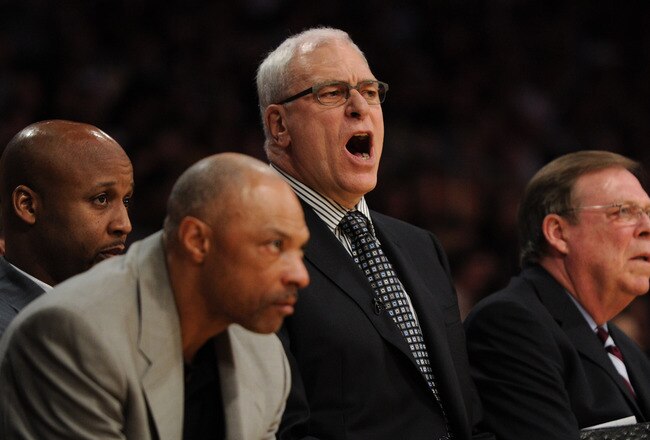 LOS ANGELES, CA - APRIL 26:  (2nd R) Head coach Phil Jackson of the Los Angeles Lakers reacts as he sits between assistant coaches (L) Jim Cleamons, (2nd L) Brian Shaw and (R) Frank Hamblen in the second quarter while taking on the New Orleans Hornets in Game Five of the Western Conference Quarterfinals in the 2011 NBA Playoffs on April 26, 2011 at Staples Center in Los Angeles, California. NOTE TO USER: User expressly acknowledges and agrees that, by downloading and or using this photograph, User is consenting to the terms and conditions of the Getty Images License Agreement.  (Photo by Harry How/Getty Images)