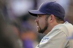 DENVER - SEPTEMBER 14:  Relief pitcher Heath Bell #21 of the San Diego Padres looks on from the dugout prior to facing the Colorado Rockies at Coors Field on September 14, 2010 in Denver, Colorado. Bell recorded his 42nd save as the Padres defeated the Rockies 7-6.  (Photo by Doug Pensinger/Getty Images)