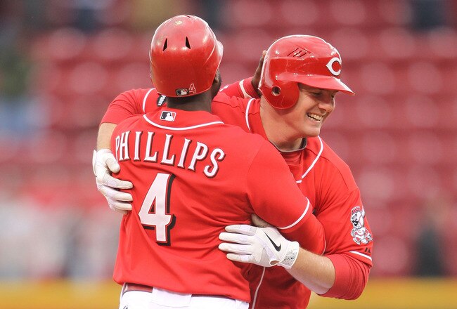 CINCINNATI, OH - MAY 04:  Jay Bruce #32 of the Cincinnati Reds celebrates with Brandon Phillips #4 after driving in the winning run in the Reds 3-2 victory over the Houston Astros at Great American Ball Park on May 4, 2011 in Cincinnati, Ohio.  (Photo by Andy Lyons/Getty Images)