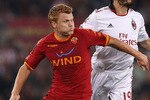 ROME, ITALY - MAY 07:  John Arne Riise of AS Roma and Christian Zambrotta (R) of AC Milan in action during the Serie A match between AS Roma and AC Milan at Stadio Olimpico on May 7, 2011 in Rome, Italy.  (Photo by Paolo Bruno/Getty Images)