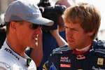 YEONGAM GUN, SOUTH KOREA - OCTOBER 22:  (L-R) German F1 drivers Michael Schumacher of Mercedes GP and Sebastian Vettel of Red Bull Racing talk as they line up for a photograph before practice for the Korean Formula One Grand Prix at the Korea International Circuit on October 22, 2010 in Yeongam-gun, South Korea.  (Photo by Mark Thompson/Getty Images)