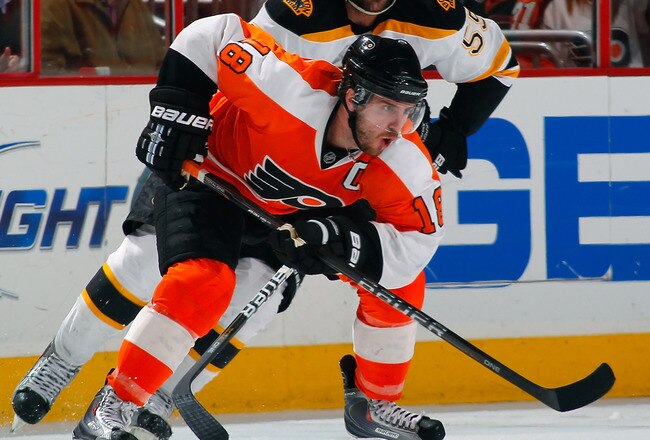 PHILADELPHIA, PA - MAY 02:  Mike Richards #18 of the Philadelphia Flyers skates with the puck in Game Two of the Eastern Conference Semifinals against the Boston Bruins during the 2011 NHL Stanley Cup Playoffs at Wells Fargo Center on May 2, 2011 in Philadelphia, Pennsylvania.  (Photo by Paul Bereswill/Getty Images)