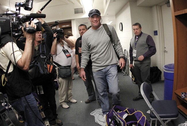 DETROIT, MI - JANUARY 02:  Brett Favre #4 of the Minnesota Vikings heads to a post game press conference after a 13-20 loss to the Detroit Lions at Ford Field on January 2, 2011 in Detroit, Michigan.  (Photo by Gregory Shamus/Getty Images)