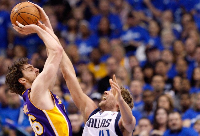DALLAS, TX - MAY 06:  Forward Pau Gasol #16 of the Los Angeles Lakers takes a shot against Dirk Nowitzki #41 of the Dallas Mavericks in Game Three of the Western Conference Semifinals during the 2011 NBA Playoffs on May 6, 2011 at American Airlines Center in Dallas, Texas.  NOTE TO USER: User expressly acknowledges and agrees that, by downloading and or using this photograph, User is consenting to the terms and conditions of the Getty Images License Agreement.  (Photo by Ronald Martinez/Getty Images)