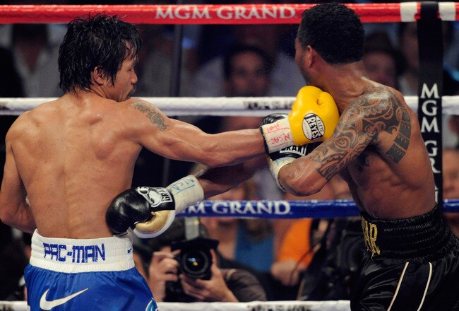 LAS VEGAS, NV - MAY 07:  (L-R) Manny Pacquiao of the Philippines throws a right at Shane Mosley in the WBO welterweight title fight at MGM Grand Garden Arena on May 7, 2011 in Las Vegas, Nevada.  (Photo by Ethan Miller/Getty Images)
