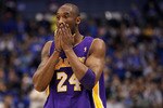 DALLAS, TX - MAY 08:  Guard Kobe Bryant #24 of the Los Angeles Lakers wipes his face during play against the Dallas Mavericks in Game Four of the Western Conference Semifinals during the 2011 NBA Playoffs on May 8, 2011 at American Airlines Center in Dallas, Texas.  NOTE TO USER: User expressly acknowledges and agrees that, by downloading and or using this photograph, User is consenting to the terms and conditions of the Getty Images License Agreement.  (Photo by Ronald Martinez/Getty Images)