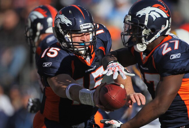DENVER - JANUARY 02:  Quarterback Tim Tebow #15 of the Denver Broncos hands the ball off to running back Knowshon Moreno #27 against the San Diego Chargers at INVESCO Field at Mile High on January 2, 2011 in Denver, Colorado.  (Photo by Doug Pensinger/Getty Images)