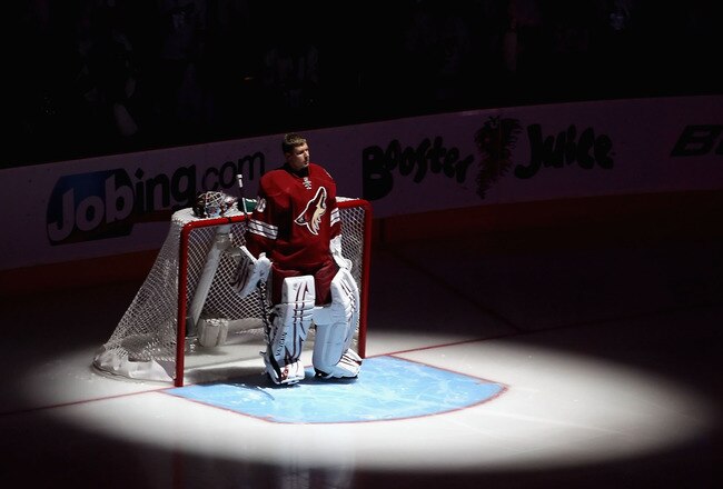 GLENDALE, AZ - APRIL 20:  Goaltender Ilya Bryzgalov #30 of the Phoenix Coyotes stands attended for the National Anthem before Game Four of the Western Conference Quarterfinals against the Detroit Red Wings during the 2011 NHL Stanley Cup Playoffs at Jobing.com Arena on April 20, 2011 in Glendale, Arizona.  The Red Wings defeated the Coyotes 6-3 to win the series 4-0.  (Photo by Christian Petersen/Getty Images)
