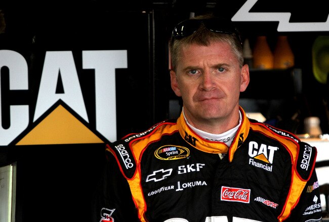 TALLADEGA, AL - APRIL 15: Jeff Burton, driver of the #31 CAT Chevrolet, stands in the garage during practice for the NASCAR Sprint Cup Series Aaron's 499 at Talladega Superspeedway on April 15, 2011 in Talladega, Alabama.  (Photo by Jerry Markland/Getty Images for NASCAR)