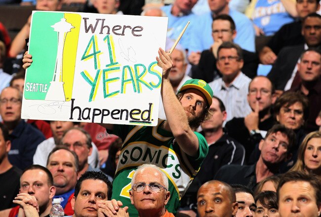 DENVER, CO - APRIL 23:  Seattle Sonics fans display signs as the support the Denver Nuggets against the Oklahoma City Thunder in Game Three of the Western Conference Quarterfinals in the 2011 NBA Playoffs on April 23, 2011 at the Pepsi Center in Denver, Colorado. NOTE TO USER: User expressly acknowledges and agrees that, by downloading and or using this photograph, User is consenting to the terms and conditions of the Getty Images License Agreement.  (Photo by Doug Pensinger/Getty Images)