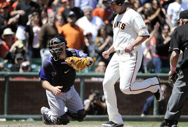 SAN FRANCISCO, CA - MAY 8: Pat Burrell #5 of the San Francisco Giants scores on Cody Ross's RBI single in the bottom of the fourth inning against the Colorado Rockies during a MLB baseball game at AT&T Park May 8, 2011 in San Francisco, California. The Giants won the game 3-0. (Photo by Thearon W. Henderson/Getty Images)