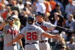 SAN FRANCISCO, CA - APRIL 24: Dan Uggla #26 and Chipper Jones #10 of the Atlanta Braves celebrate after they scored in the 10th inning against the San Francisco Giants at AT&T Park on April 24, 2011 in San Francisco, California.  (Photo by Ezra Shaw/Getty Images)