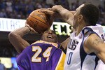 DALLAS, TX - MAY 08:  Guard Kobe Bryant #24 of the Los Angeles Lakers is fouled by Shawn Marion #0 of the Dallas Mavericks in Game Four of the Western Conference Semifinals during the 2011 NBA Playoffs on May 8, 2011 at American Airlines Center in Dallas, Texas.  NOTE TO USER: User expressly acknowledges and agrees that, by downloading and or using this photograph, User is consenting to the terms and conditions of the Getty Images License Agreement.  (Photo by Ronald Martinez/Getty Images)