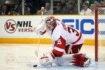 SAN JOSE, CA - MAY 08:  Jimmy Howard #35 of the Detroit Red Wings makes a save during their game against the San Jose Sharks in Game Five of the Western Conference Semifinals during the 2011 NHL Stanley Cup Playoffs at HP Pavilion on May 8, 2011 in San Jose, California.  (Photo by Ezra Shaw/Getty Images)