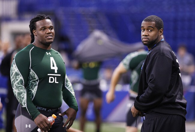 INDIANAPOLIS, IN - FEBRUARY 28: Former North Carolina teammates Marvin Austin (L) and Bruce Carter look on during the 2011 NFL Scouting Combine at Lucas Oil Stadium on February 28, 2011 in Indianapolis, Indiana. (Photo by Joe Robbins/Getty Images)