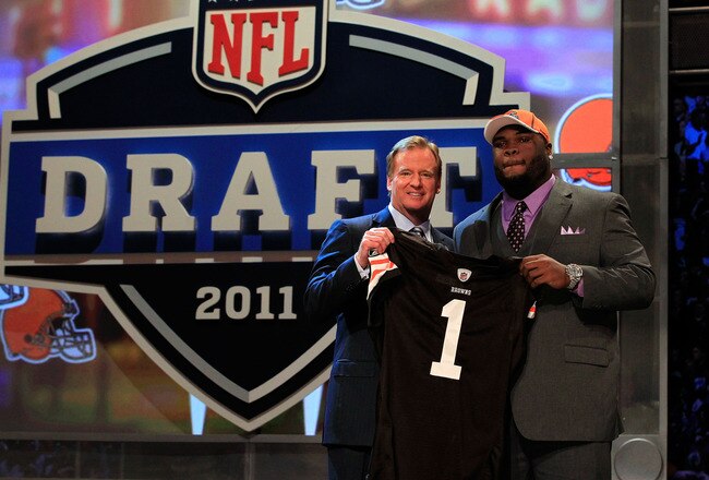 NEW YORK, NY - APRIL 28:  NFL Commissioner Roger Goodell (L) poses for a photo with Phil Taylor, #21 overall pick by the Cleveland Browns, on stage during the 2011 NFL Draft at Radio City Music Hall on April 28, 2011 in New York City.  (Photo by Chris Trotman/Getty Images)