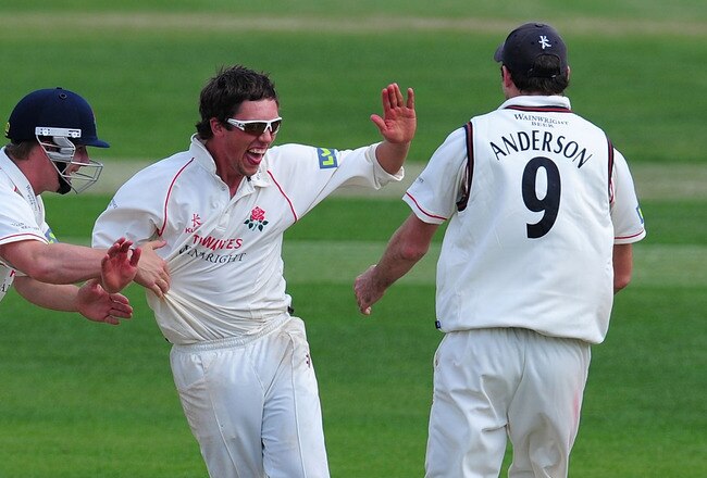 BIRMINGHAM, ENGLAND - MAY 06: Lancashire bowler Simon Kerrigan (c) celebrates with James Anderson (r) after he had dismissed Warwickshire batsman Mohammad Yousuf during day three of the Division One LV County Championship match between Warwickshire and Lancashire at Edgbaston on May 6, 2011 in Birmingham, England.  (Photo by Stu Forster/Getty Images)
