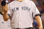 ARLINGTON, TX - MAY 07:  Pitcher Bartolo Colon #40 of the New York Yankees throws the ball in the air before being relieved against the Texas Rangers at Rangers Ballpark in Arlington on May 7, 2011 in Arlington, Texas.  (Photo by Ronald Martinez/Getty Images)