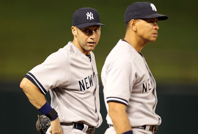 ARLINGTON, TX - MAY 07:  Derek Jeter #2 and Alex Rodriguez #13 of the New York Yankees talk between innings at Rangers Ballpark in Arlington on May 7, 2011 in Arlington, Texas.  (Photo by Ronald Martinez/Getty Images)