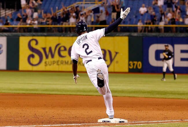 ST. PETERSBURG, FL - MAY 03:  Outfielder B.J. Upton #2 of the Tampa Bay Rays celebrates his two run walkoff home run against the Toronto Blue Jays at Tropicana Field on May 3, 2011 in St. Petersburg, Florida.  (Photo by J. Meric/Getty Images)