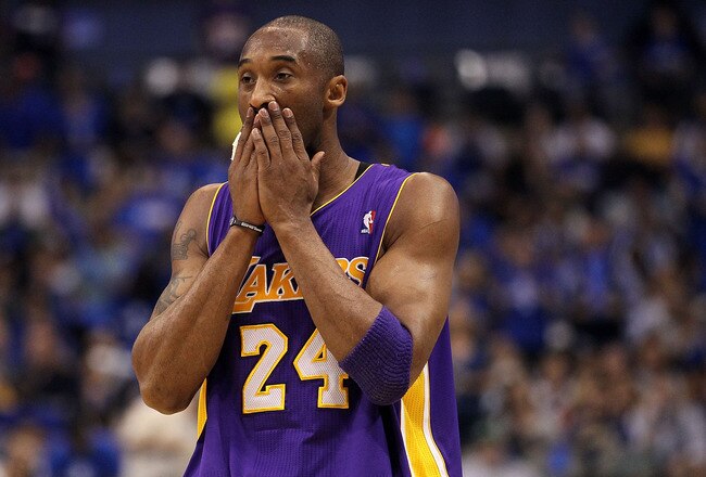 DALLAS, TX - MAY 08:  Guard Kobe Bryant #24 of the Los Angeles Lakers wipes his face during play against the Dallas Mavericks in Game Four of the Western Conference Semifinals during the 2011 NBA Playoffs on May 8, 2011 at American Airlines Center in Dallas, Texas.  NOTE TO USER: User expressly acknowledges and agrees that, by downloading and or using this photograph, User is consenting to the terms and conditions of the Getty Images License Agreement.  (Photo by Ronald Martinez/Getty Images)