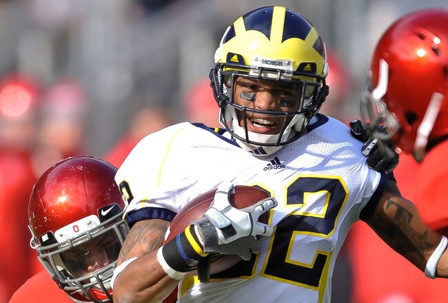 COLUMBUS, OH - NOVEMBER 27:  Darryl Stonum #22 of the Michigan Wolverines runs with the ball against the Ohio State Buckeyes at Ohio Stadium on November 27, 2010 in Columbus, Ohio.  (Photo by Jamie Sabau/Getty Images)