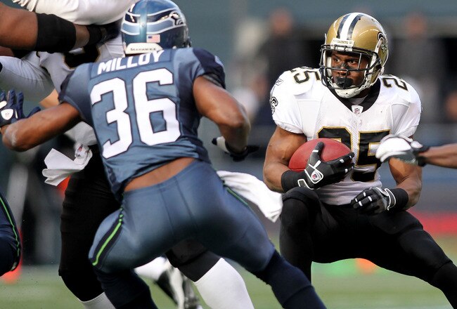 SEATTLE, WA - JANUARY 08:  Reggie Bush #25 of the New Orleans Saints runs down field against Lawyer Milloy #36 of the Seattle Seahawks during the 2011 NFC wild-card playoff game at Qwest Field on January 8, 2011 in Seattle, Washington.  (Photo by Jonathan Ferrey/Getty Images)