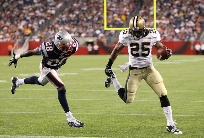 FOXBORO, MA - AUGUST 12: Reggie Bush # 25 of the New Orleans Saints scores a touchdown against the defense of Darius Butler # 28 of the New England Patriots during the preseason game against the New England Patriots at Gillette Stadium on August 12, 2010 in Foxboro, Massachusetts. (Photo by Jim Rogash/Getty Images)
