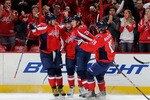 WASHINGTON - NOVEMBER 28:  Alexander Semin #28 of the Washington Capitals celebrates with Alex Ovechkin #8, Mike Green #52 and Nicklas Backstrom #19 after scoring in the first period against the Carolina Hurricanes at the Verizon Center on November 28, 2010 in Washington, DC.  (Photo by Greg Fiume/Getty Images)